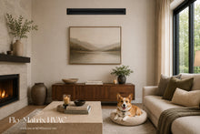 Load image into Gallery viewer, Black linear slot diffuser installed high on the wall in a modern living room, showcasing a sleek HVAC air vent design by Flo-Matrix.
