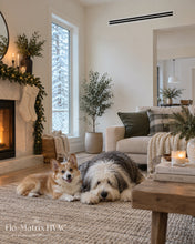 Load image into Gallery viewer, White linear slot diffuser HVAC vent installed in a modern living room with a cozy winter interior.
